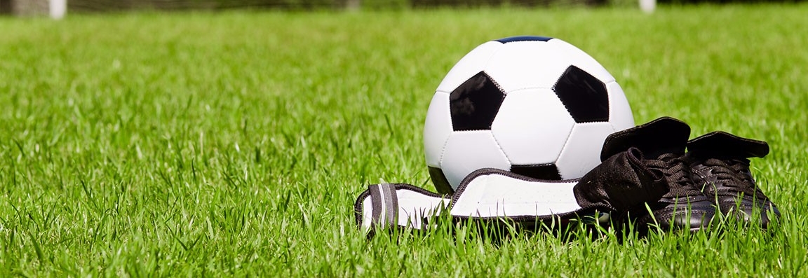 Child soccer or football gear on field